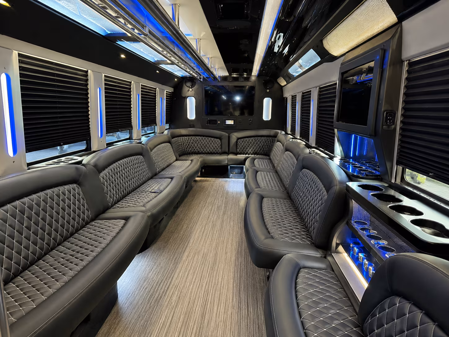 Group beside a Mercedes Sprinter limo in Raleigh